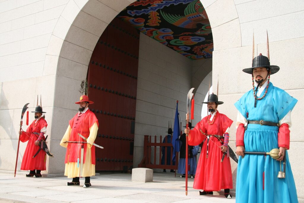 Royal palace guards standing outside Gwanghwamun